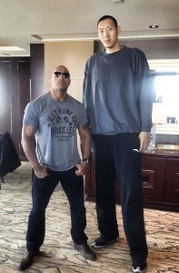 The Rock (6ft5) next to Sun Ming Ming (7ft9 of China)
